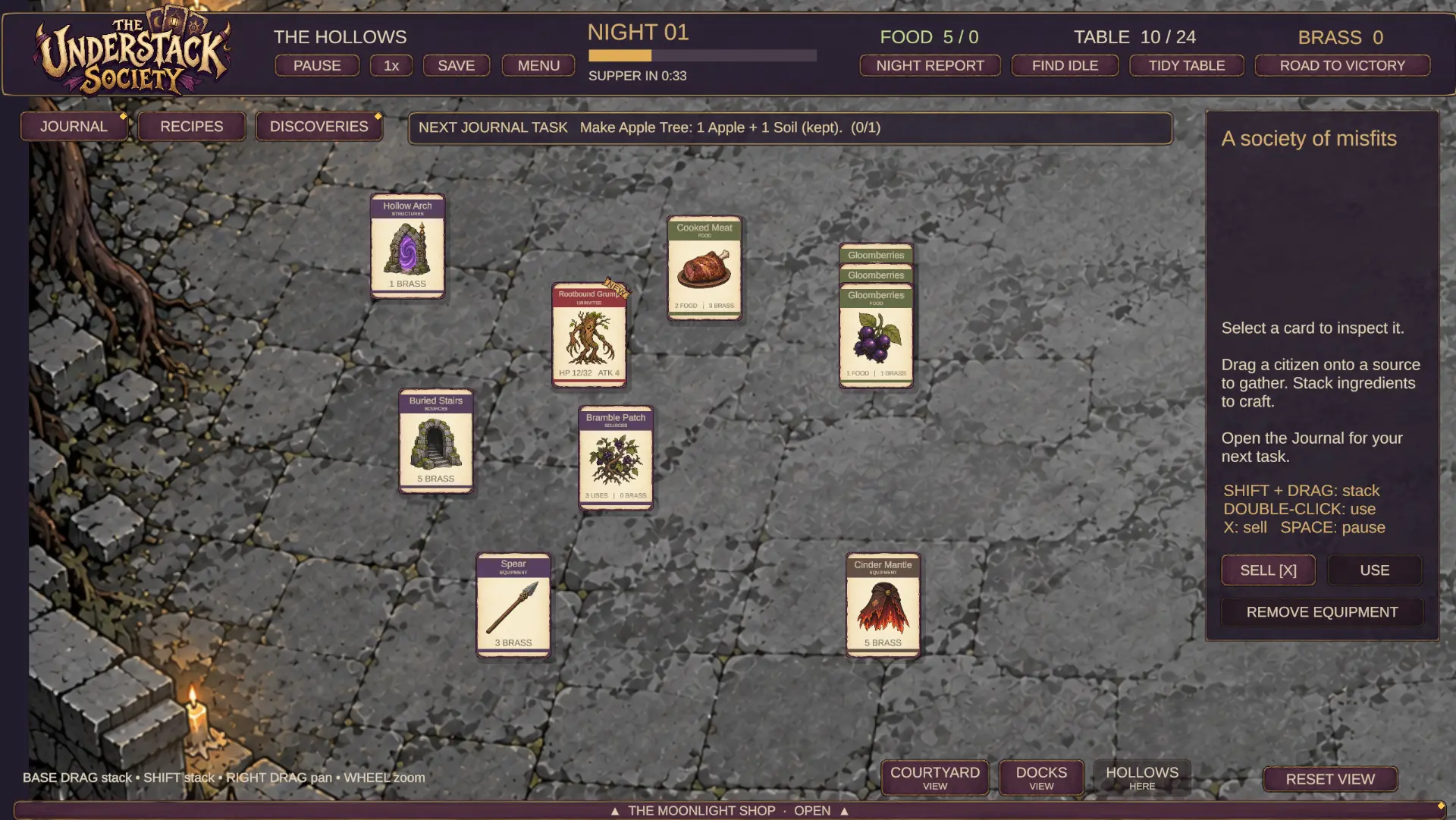 The Hollows at night, with starting cards laid out beside a candle